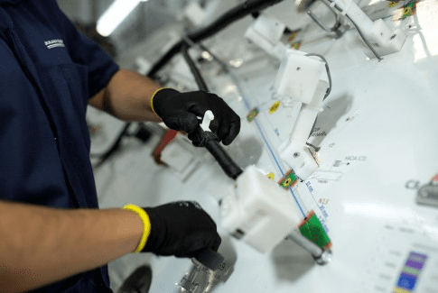 man working in the electric board